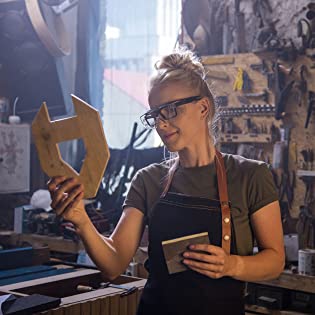 Woman holding NoCry logo