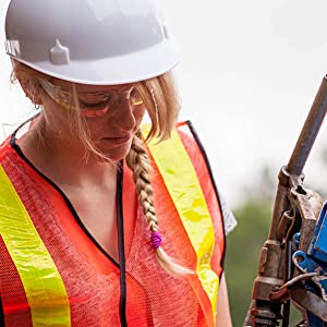 Image of a woman wearing clear lens clear temple safety glasses.